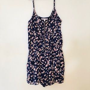 Navy floral romper with mid-zipper
